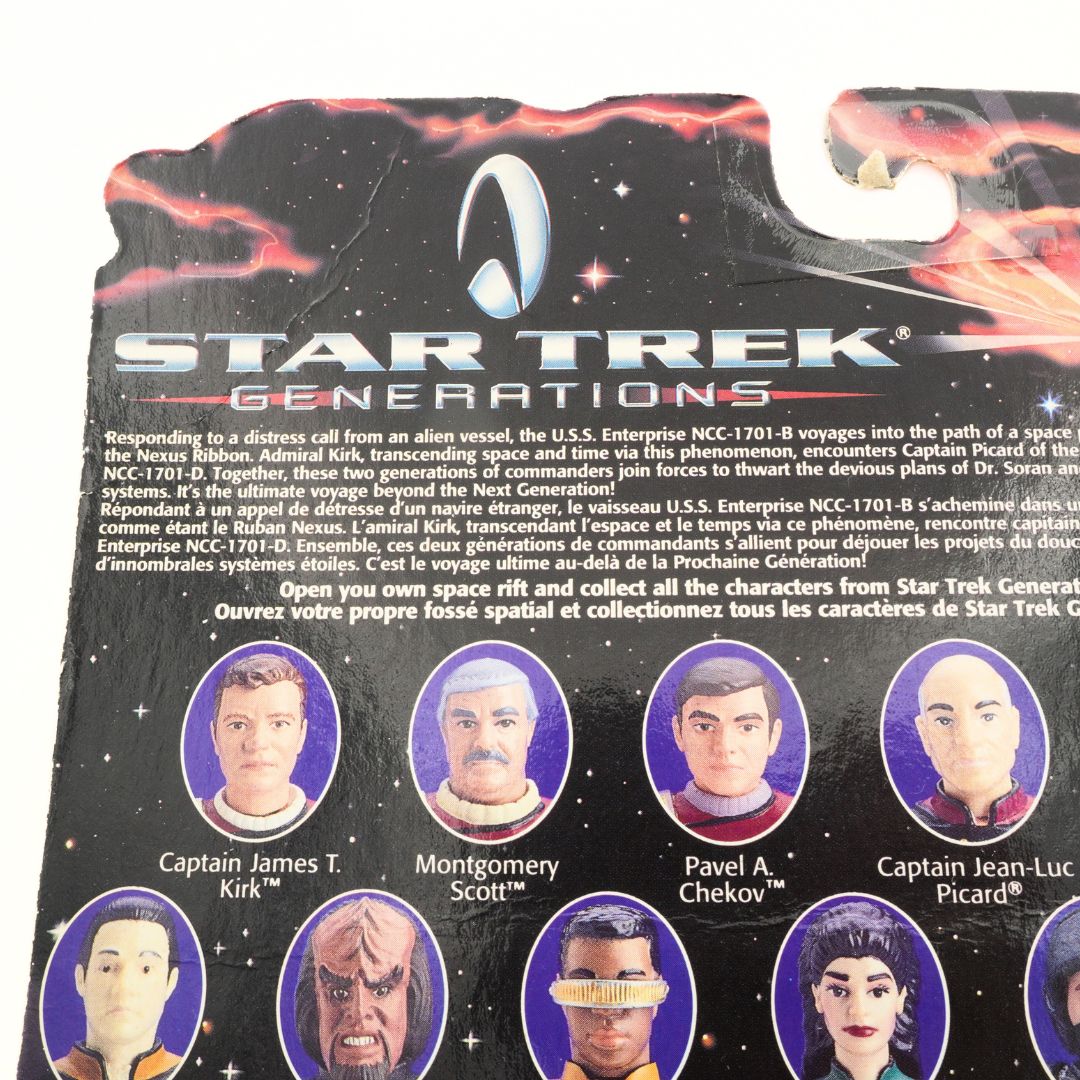 Closeup of the creasing and story information on the back of a Star Trek Generations Data figurine
