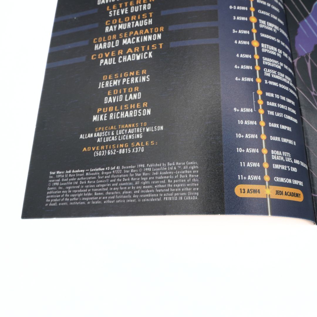 Comic book page with credits and a character illustration on a white background