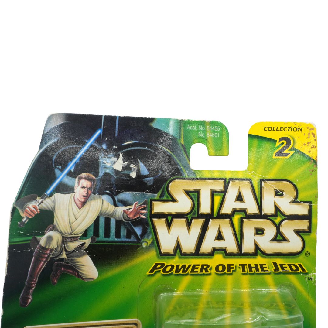 Star Wars Power of the Jedi toy figure packaging with character holding a lightsaber.