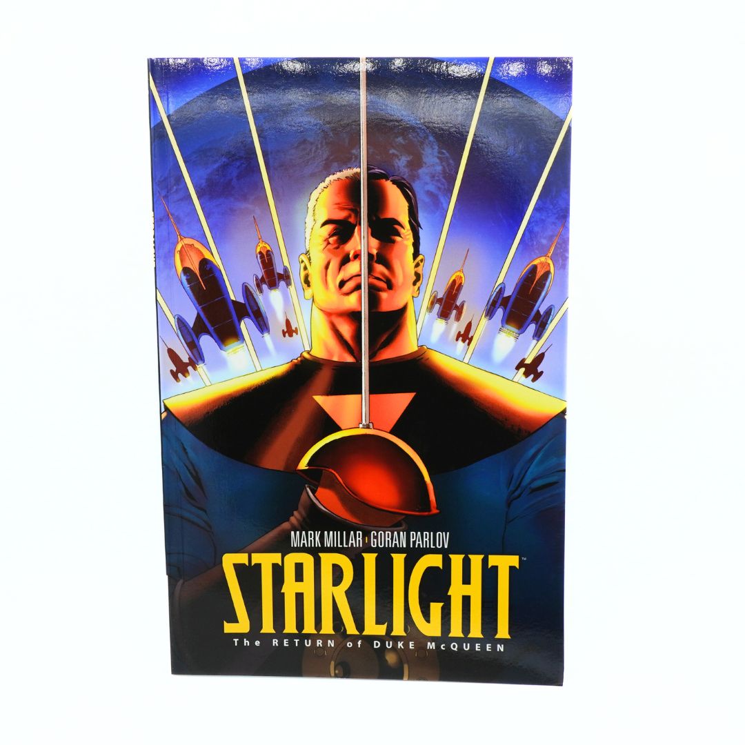 Starlight: The Return of Duke McQueen graphic novel or comic book cover, featuring a stylized illustration of a man in a black and gold costume against a blue space background with fighter jets, shown standing upright on a white background.