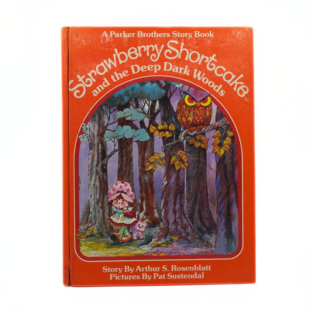 Book cover of 'Strawberry Shortcake and the Deep Dark Woods' by Parker Brothers on a white background