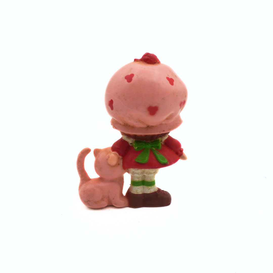 Pink character with a cat on a white background