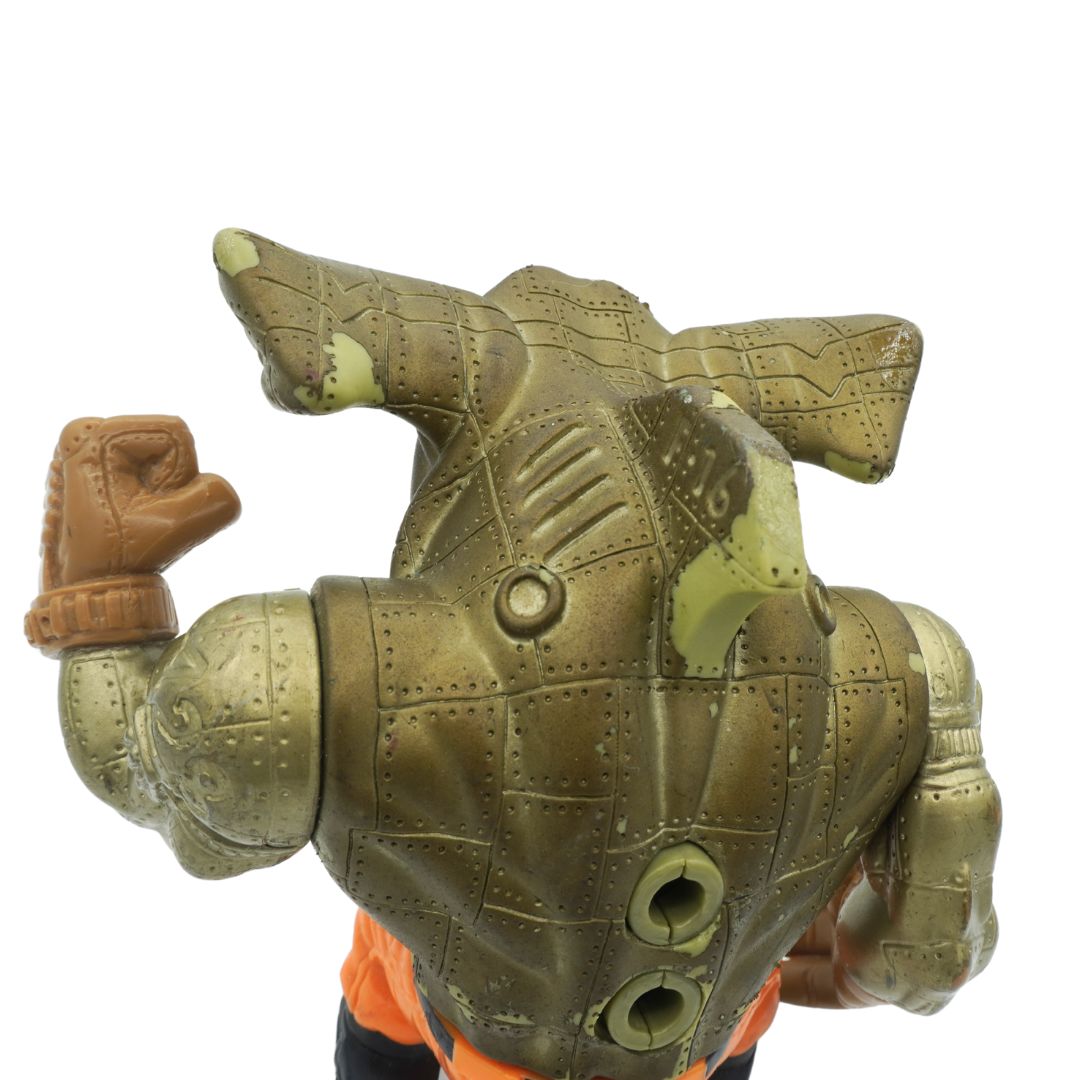 Toy figure of a robot with a detailed head and arm on a white background