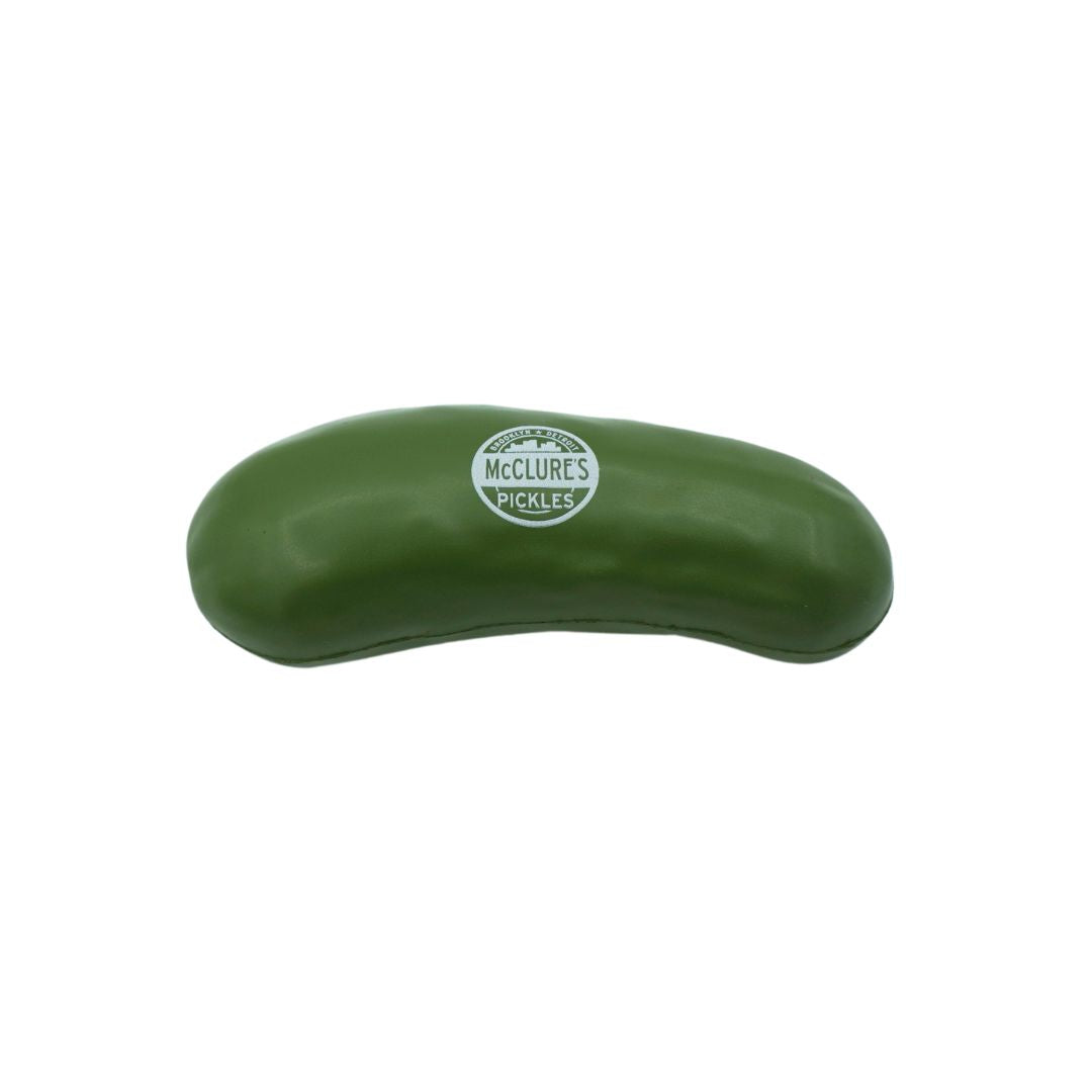 A green stress ball shaped like a pickle with McClure's branding