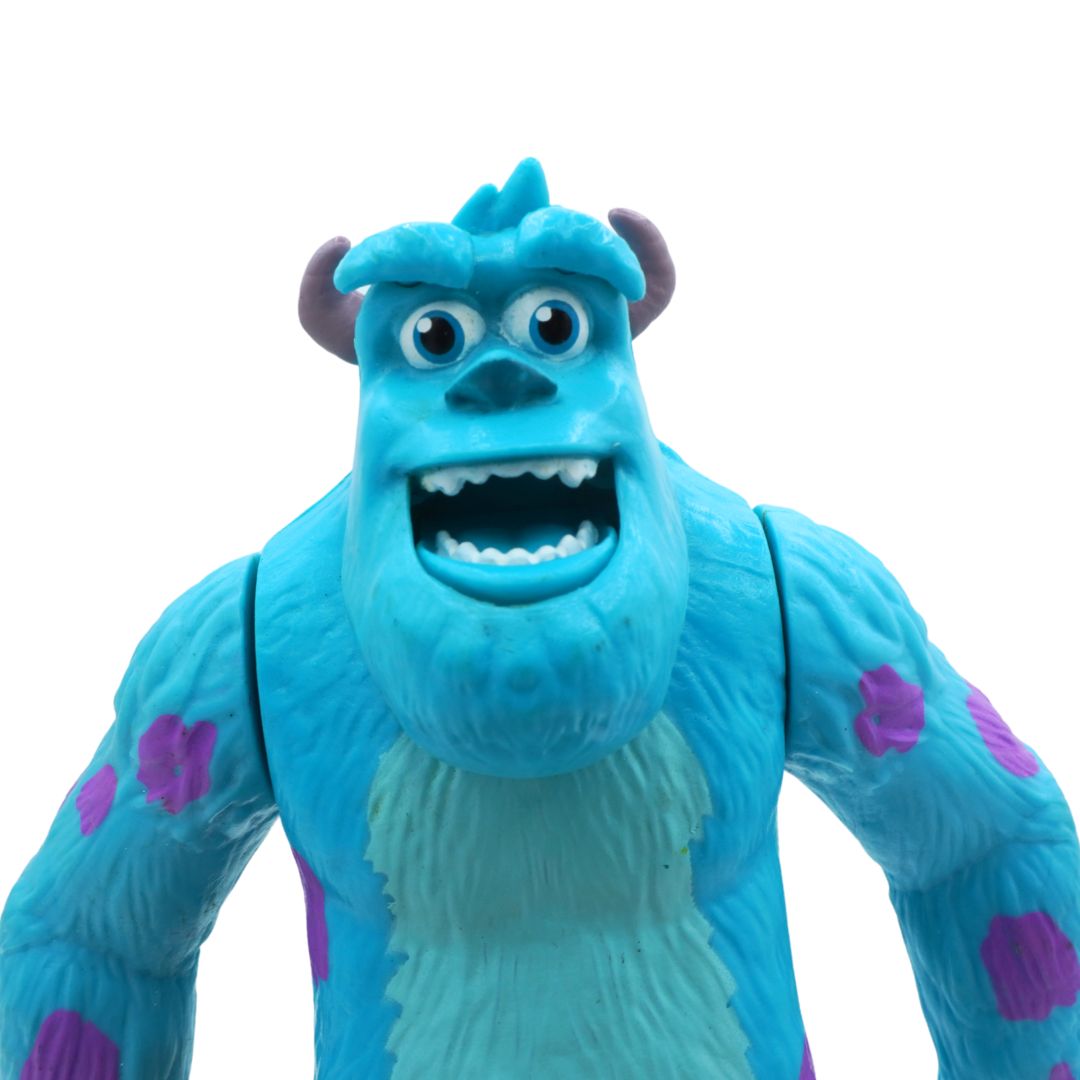 Blue animated character with purple spots on a white background