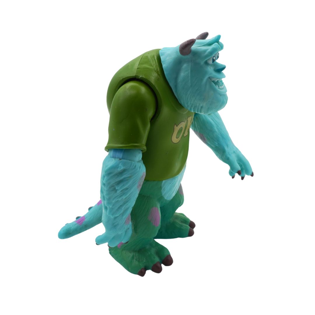 Toy figure of a character with green shirt and blue skin on a white background