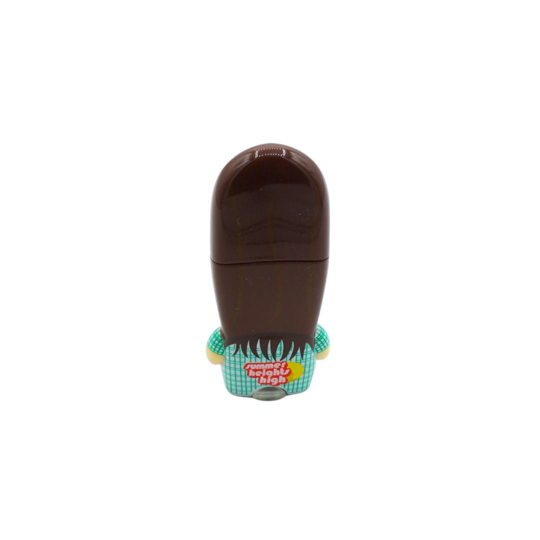 A small novelty container shaped like a person's head with dark brown hair, a green and white checkered shirt, and a red 'Tommy Hilfiger' logo patch on the front, shown on a plain white background.