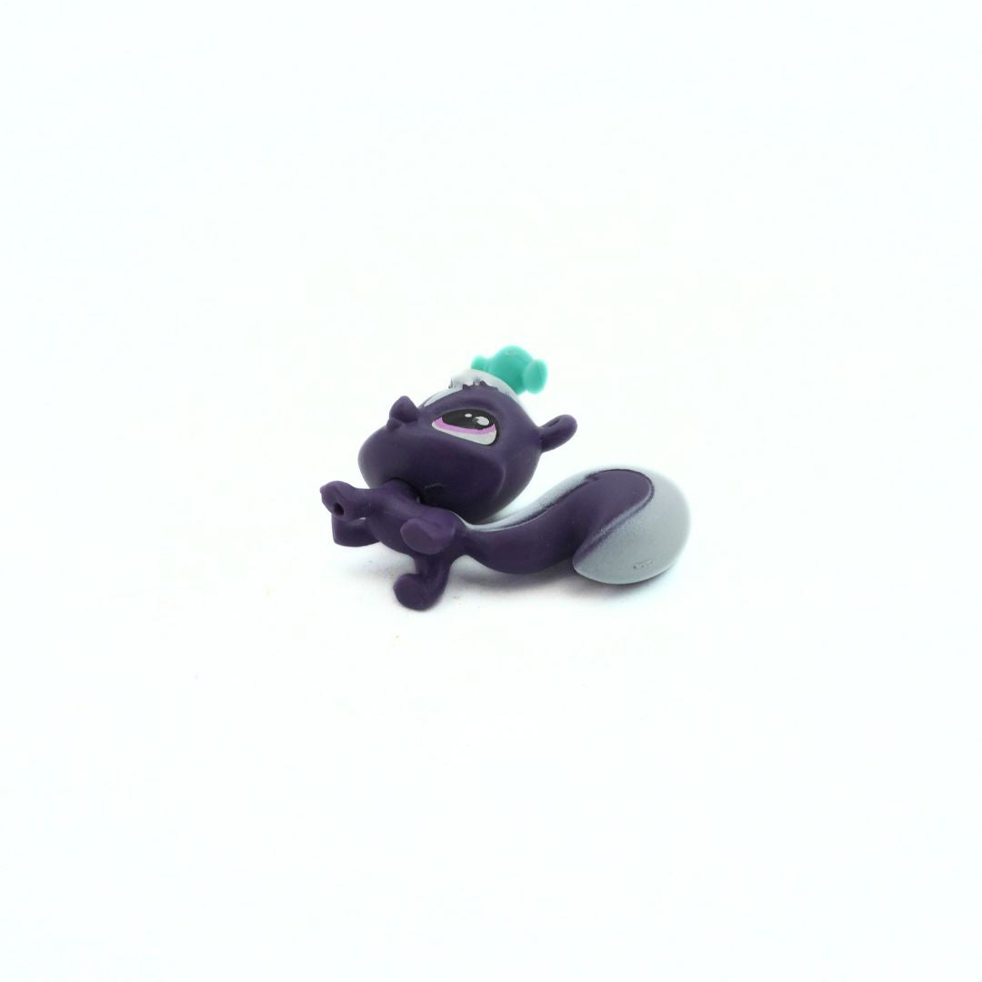 Purple and gray toy figure with a green bottle on its head, on a white background