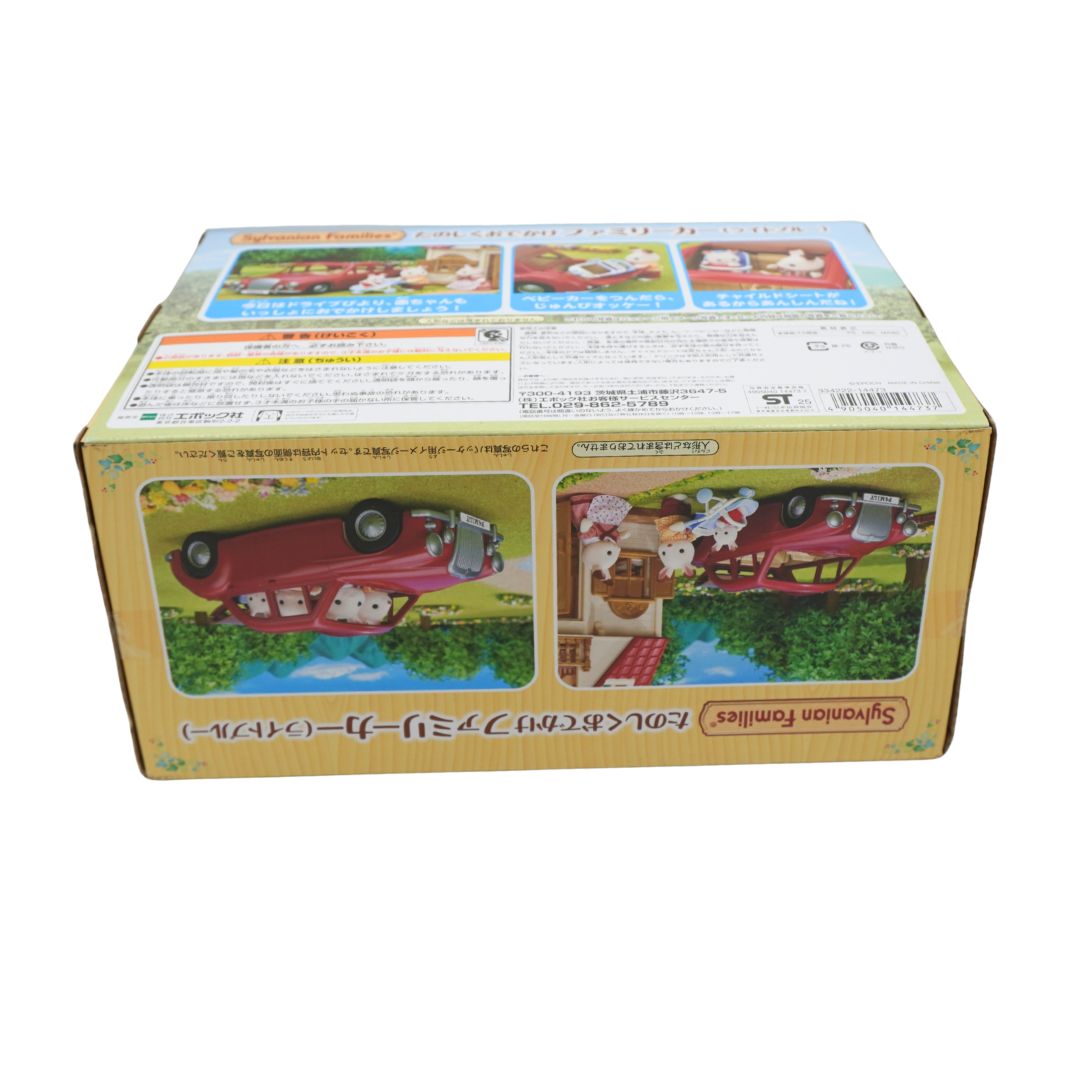 Sylvanian Families wooden toy set box with Japanese text, showing illustrations of a red car and a picnic scene on the front, photographed on a white background.