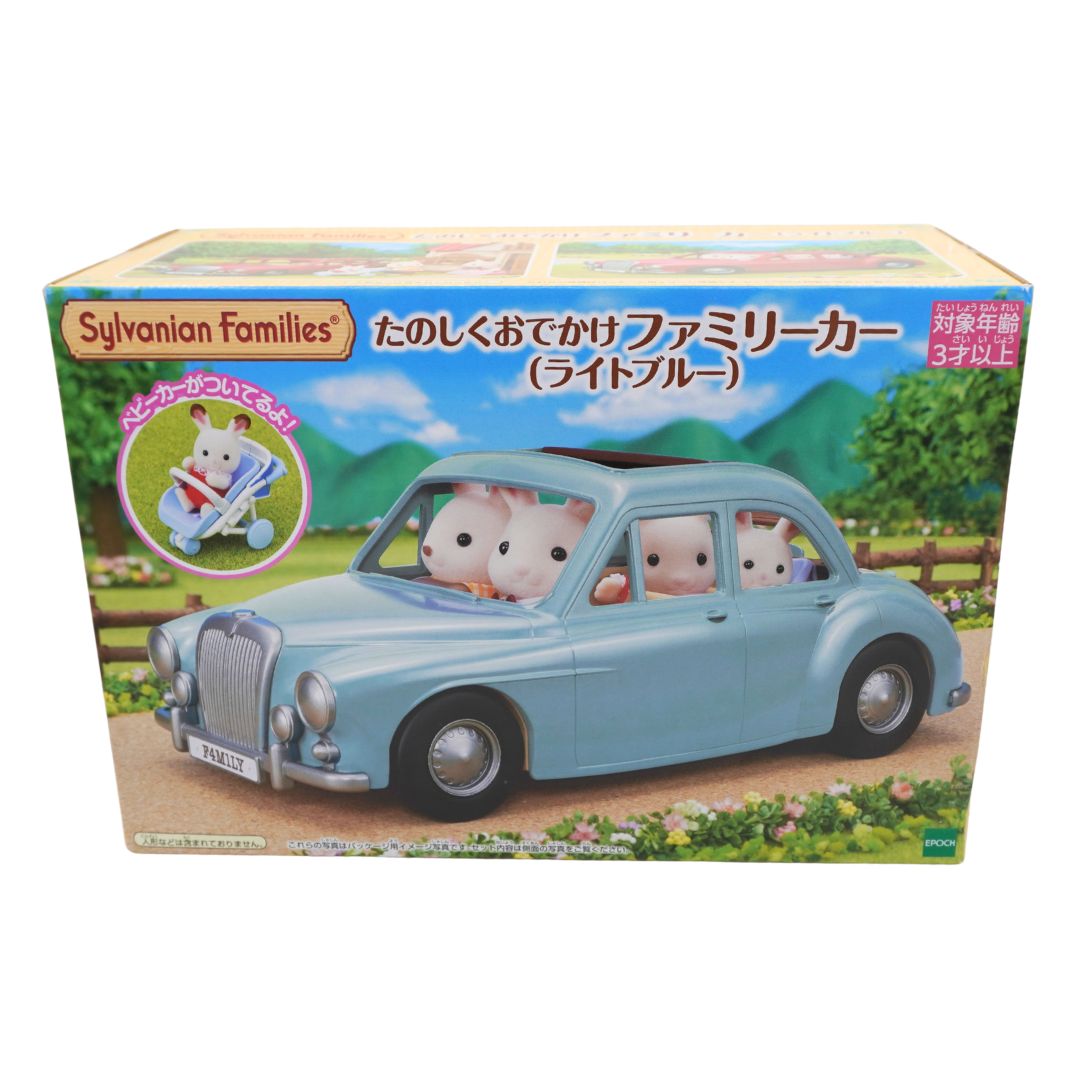 Sylvanian Families toy car set in its original Japanese packaging, featuring a light blue family car with animal passengers.