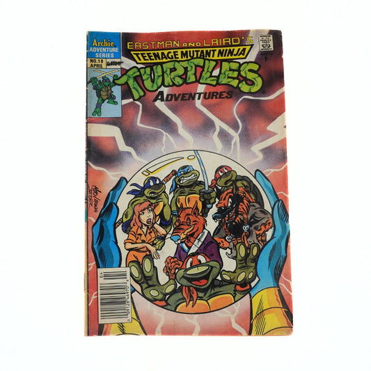 Comic book cover of Teenage Mutant Ninja Turtles Adventures with colorful artwork on a white background