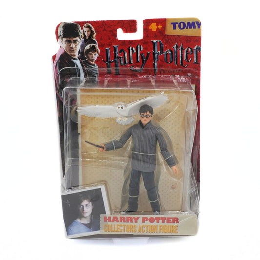 Packaged Harry Potter action figure with Tomy branding on a white background