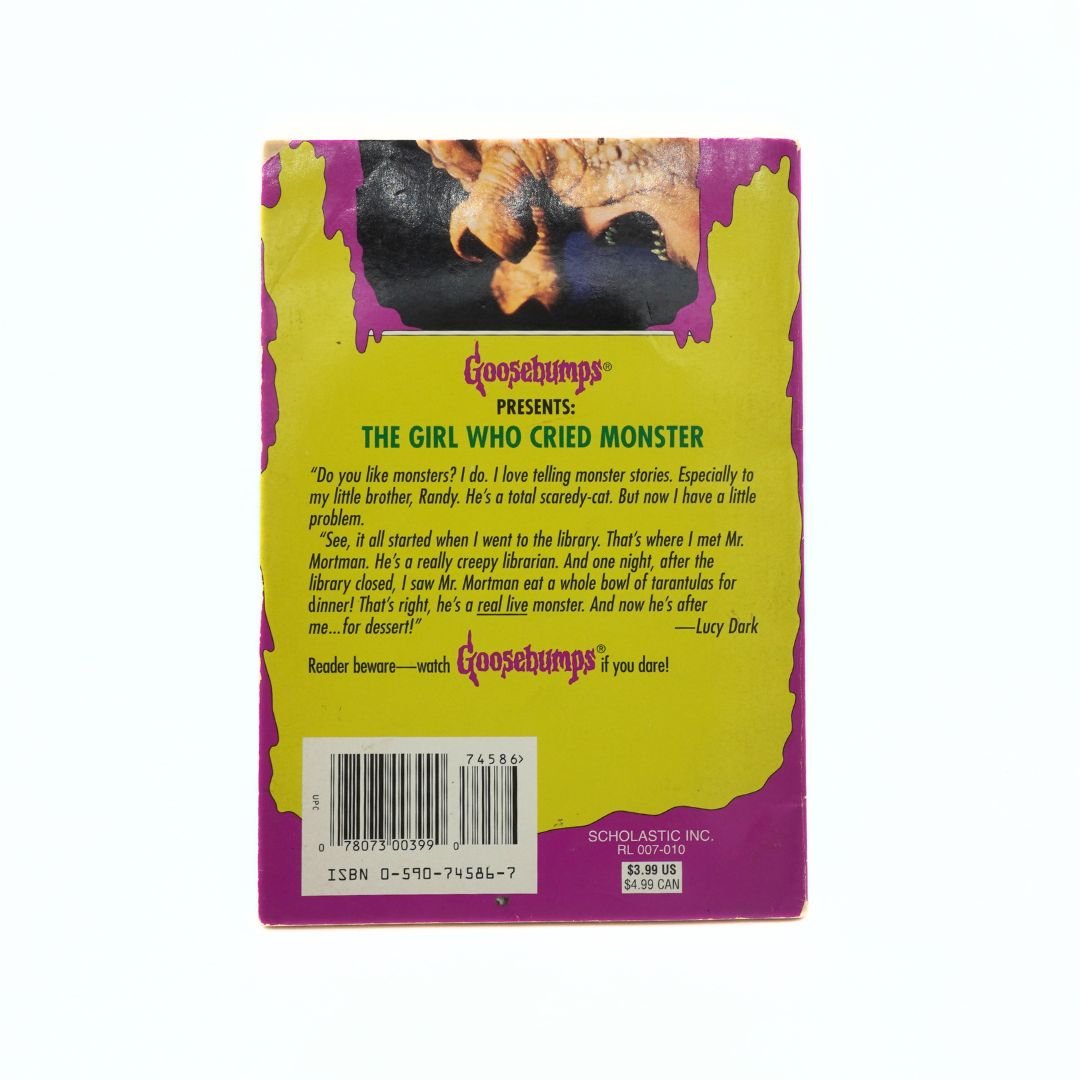 Back cover of a Goosebumps book titled 'The Girl Who Cried Monster' with a yellow and purple design.
