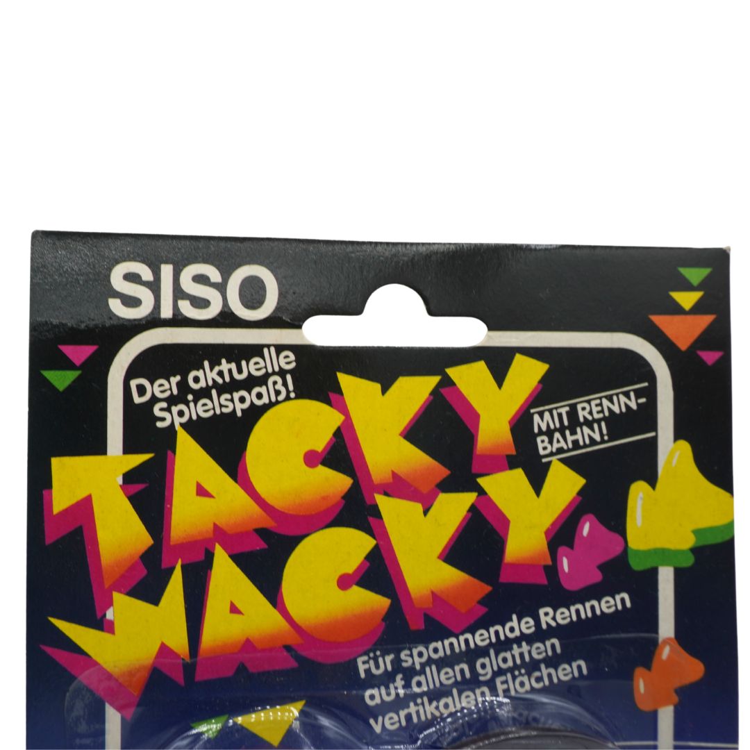 Packaging of SISO Tacky Wacky toy with colorful text and graphics on a black background
