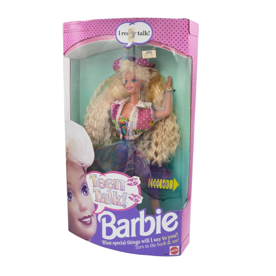 Barbie doll in packaging with 'Teen Talk' feature on a white background