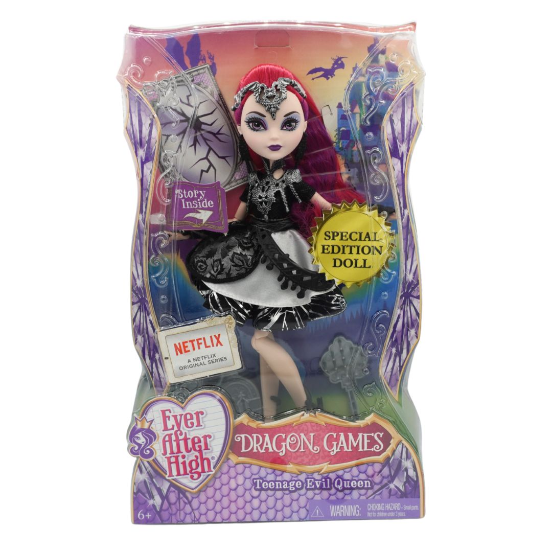 Ever After High Dragon Games Teenage Evil Queen doll in its original packaging, featuring a red-haired doll in a black and white dress with a purple sash, alongside a spider accessory.