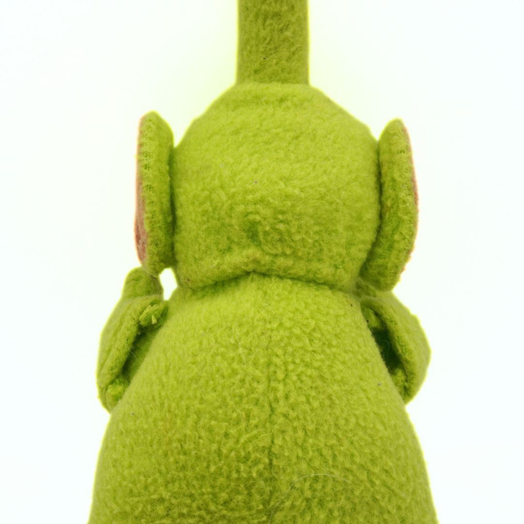 Back of a vintage 90s Teletubby plush puppet of the green character Dipsy