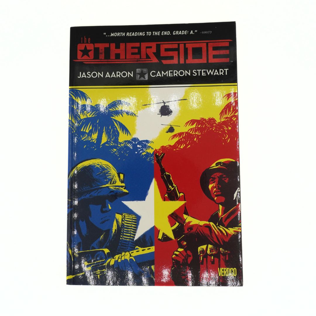 Front cover of the comic The Other Side with a blue, red and yellow colour palette