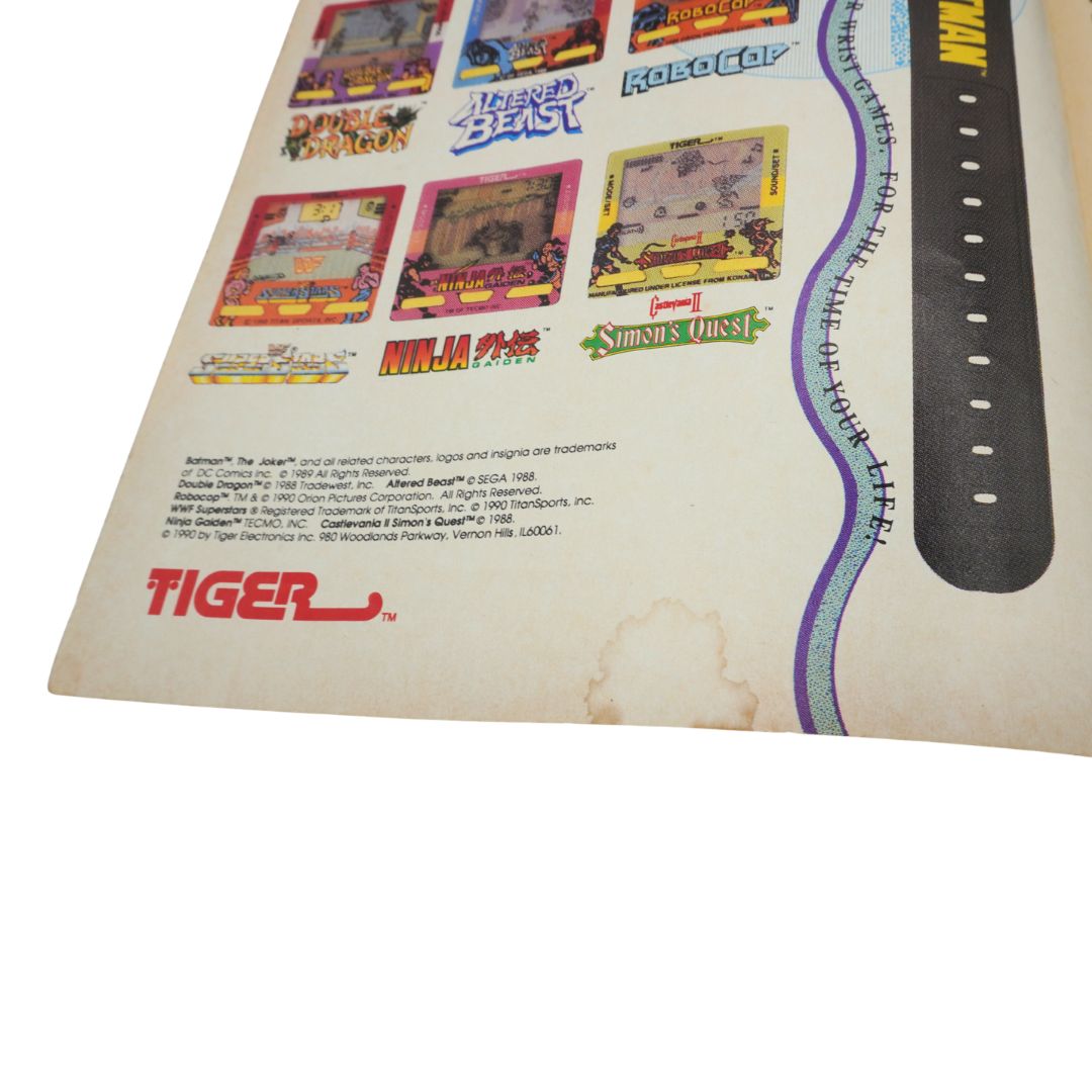 Water damage to a comic book page featuring a Tiger electronics ad