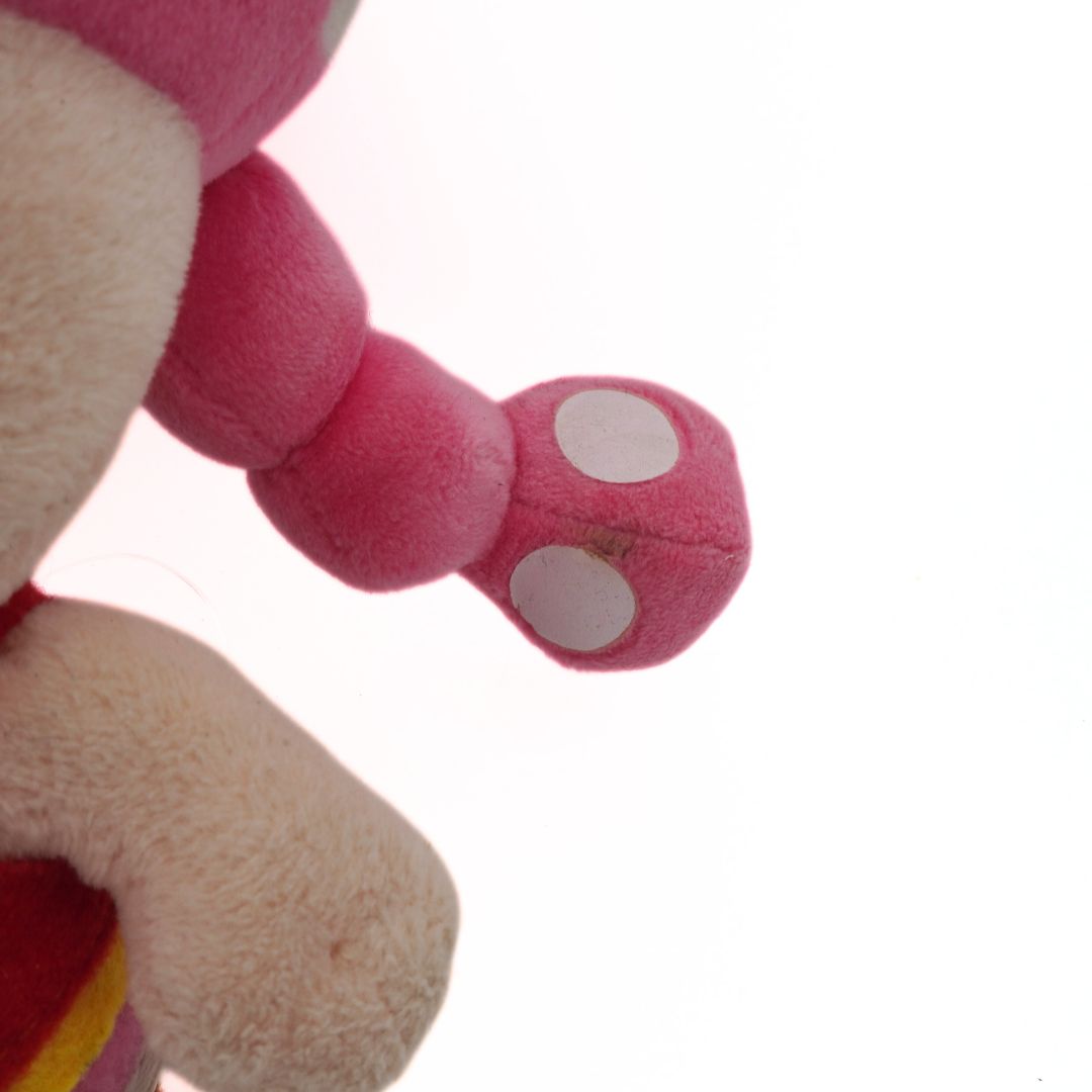 Close-up of a pink plush toy with a white background