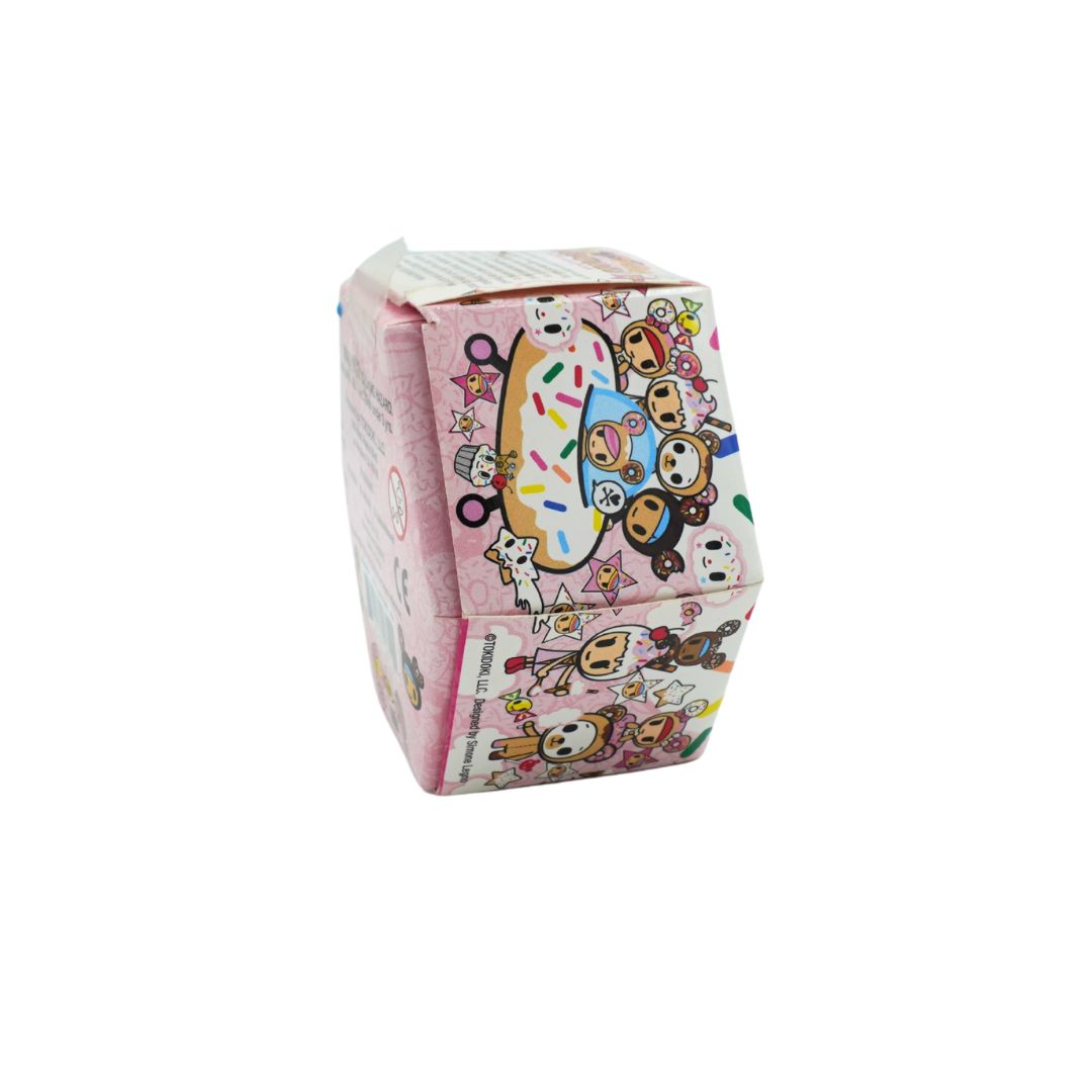 Donut themed hexagonal box for Donutella and her Sweet Friends by Tokidoki, photographed on a white background