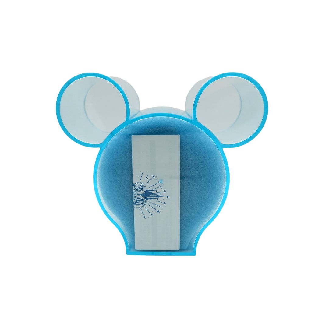 Photo of the back of the Tokyo Disney Resort Tinkerbell watch inside a blue acrylic Mickey Shaped box