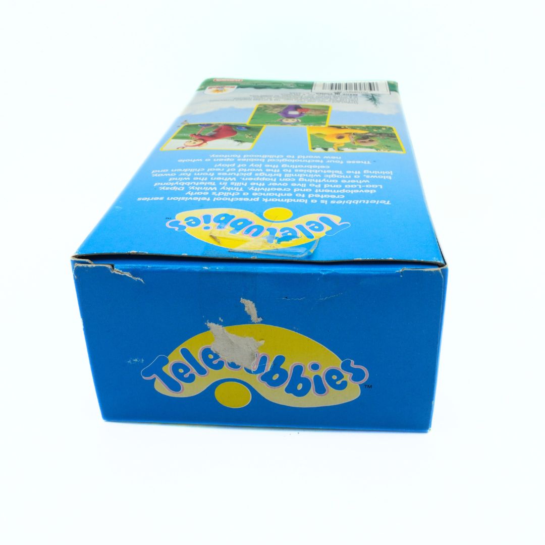 Top down photo of a vintage Teletubbies box showing some damage