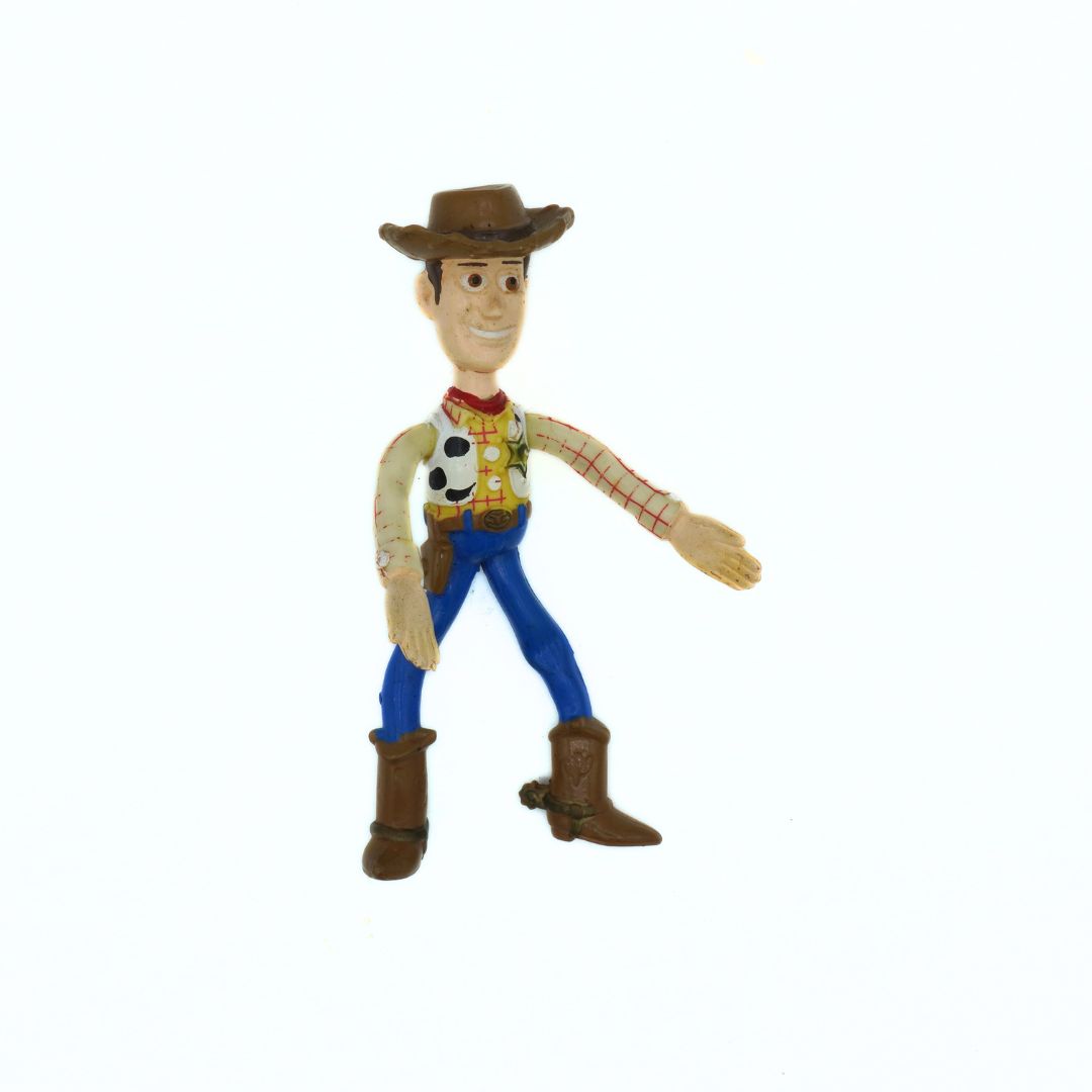 Toy figure of a cowboy character on a white background