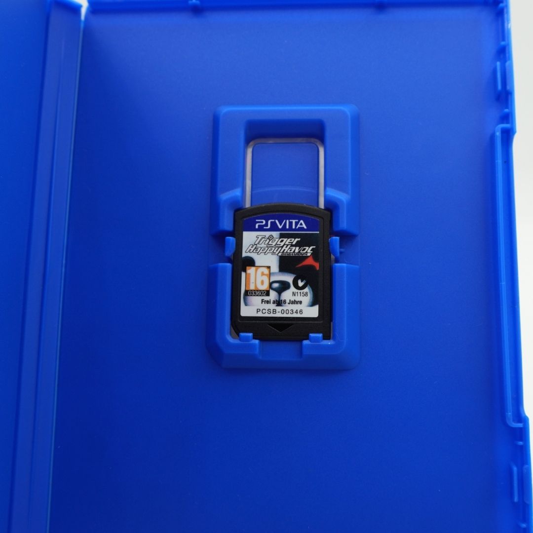 A PlayStation with a PS Vita-style label, secured in a blue plastic case.