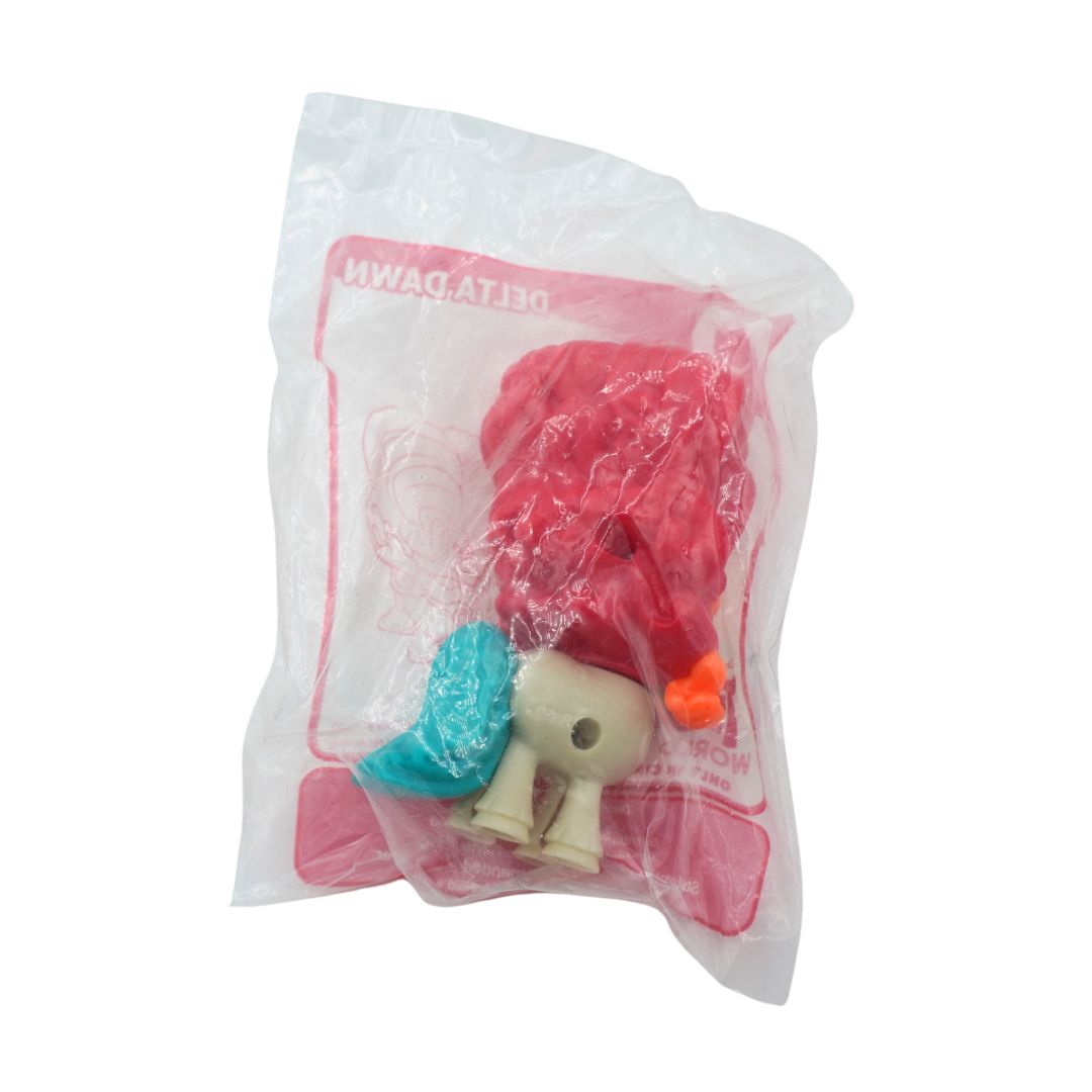 A packaged toy figure inside a clear plastic bag with a pink printed border. The figure has a red head, and an orange beak, with the text 'DELTA DAWN' visible on the packaging.