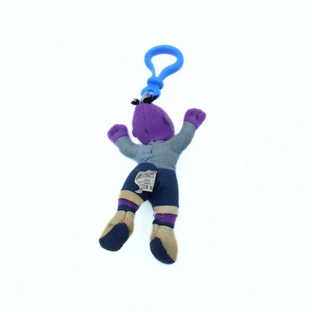 Plush toy with a blue clip on a white background