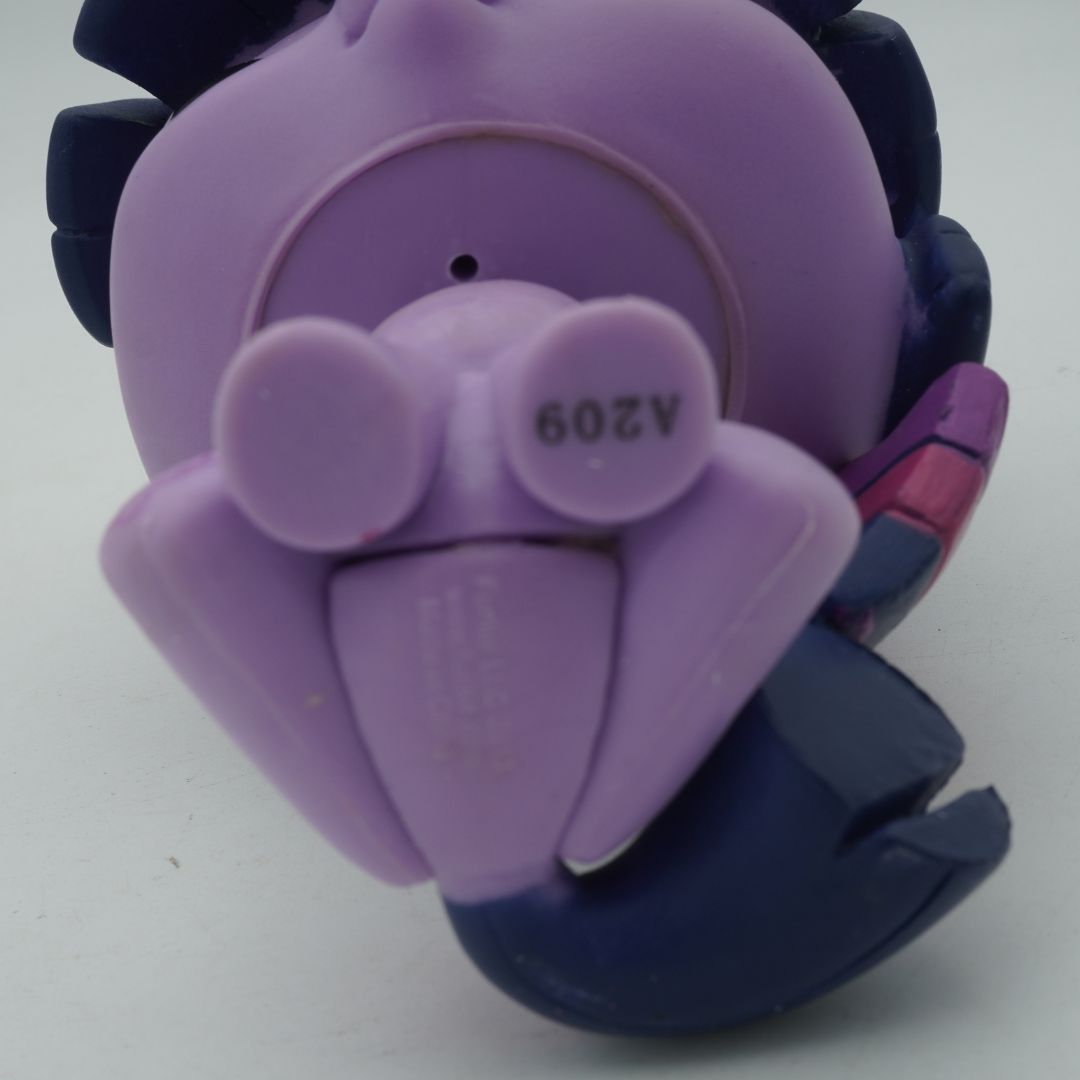 Underside of a purple Funko Pop showing the branding of the toy
