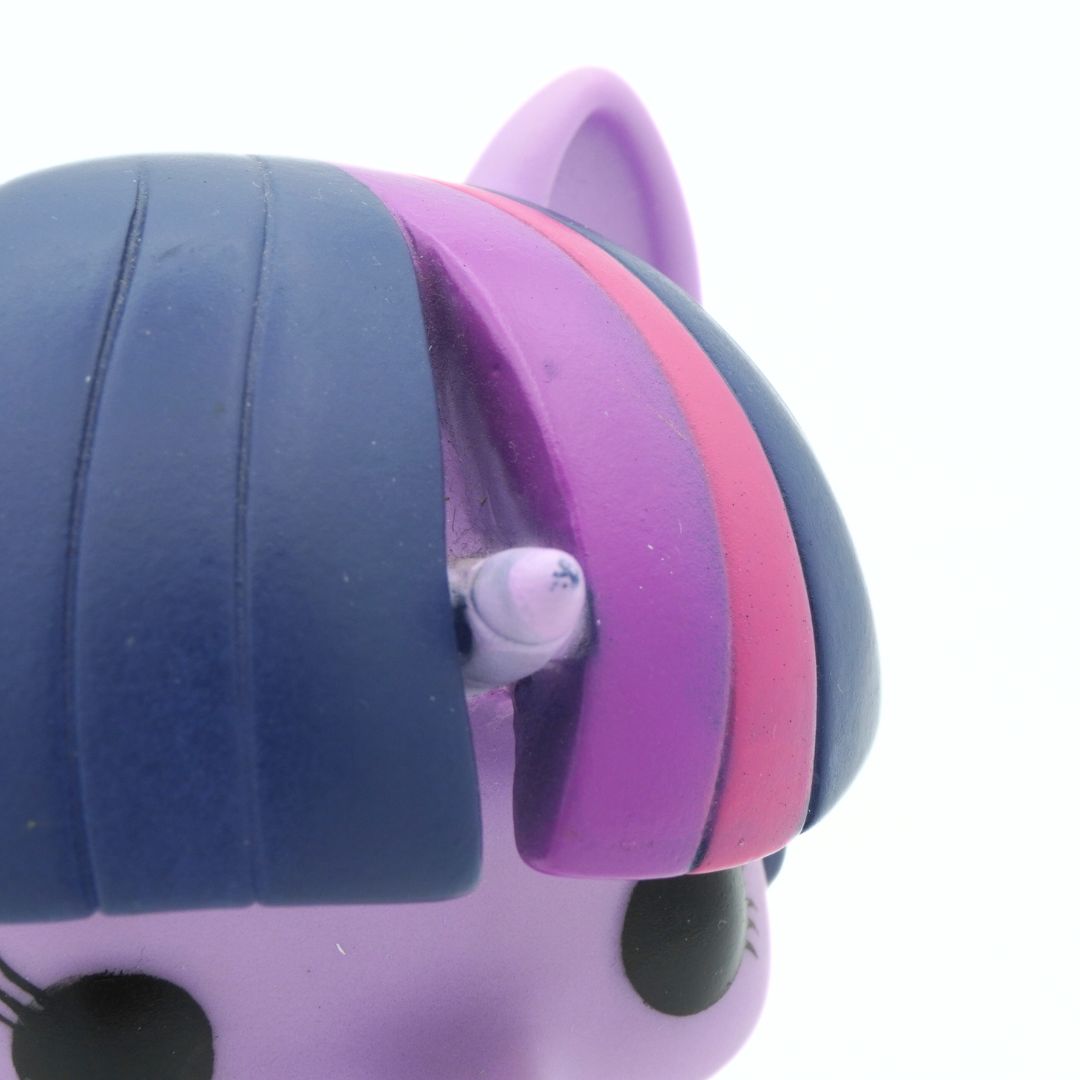 Purple unicorn horn on a 2013 Funko Pop toy