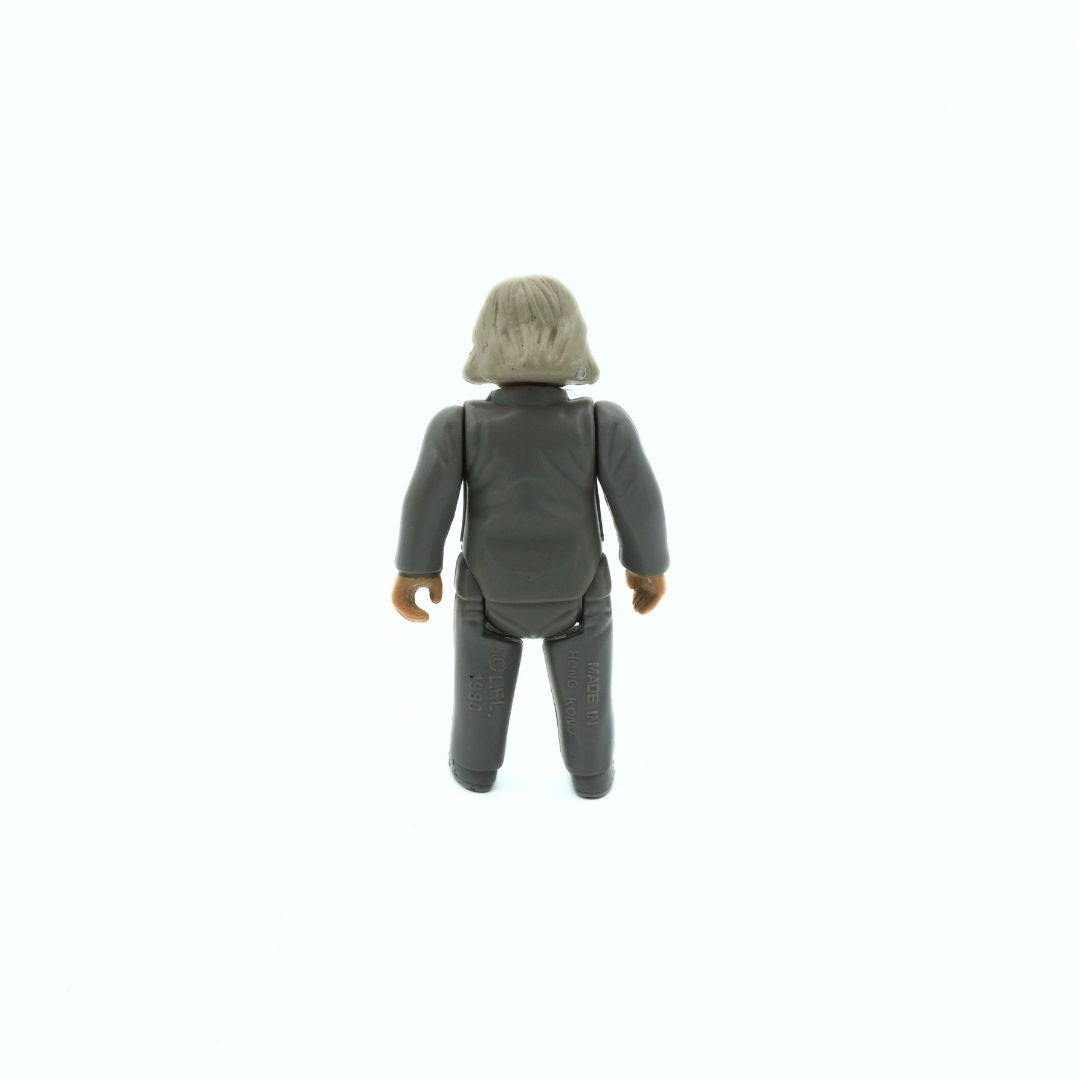 Action figure with gray outfit and helmet on a white background