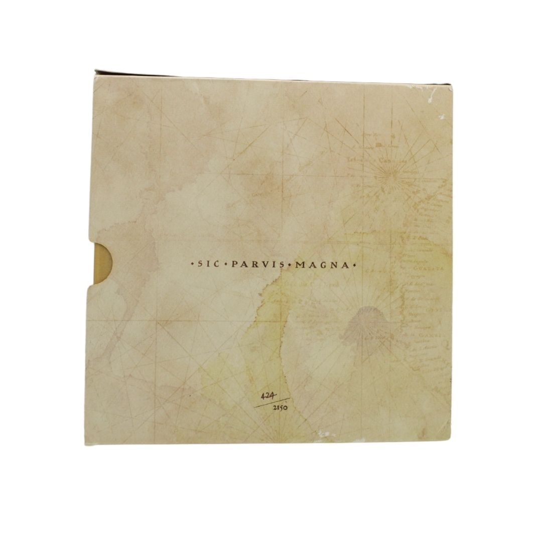 A square beige paper product with an aged, map-like printed design and the centered text 'SIC PARVIS MAGNA' on a plain white background.