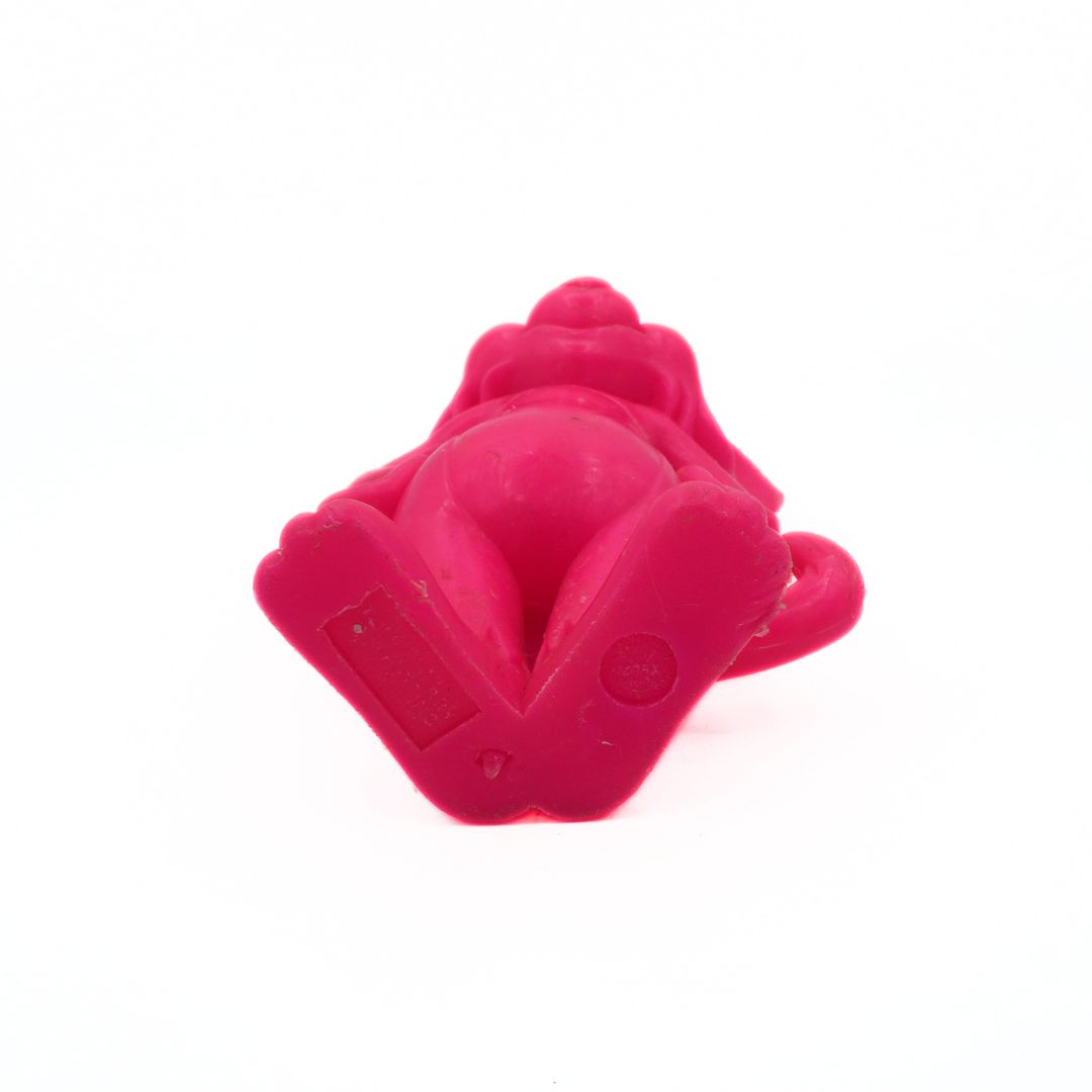 Pink silicone ring with a unique design on a white background