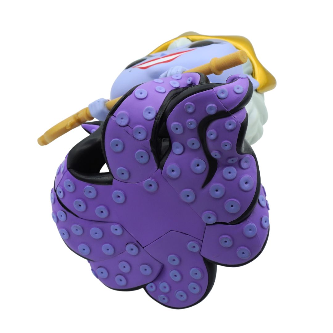 Jumbo sized purple Ursula figurine from the Little Mermaid with a gold crown and black dress