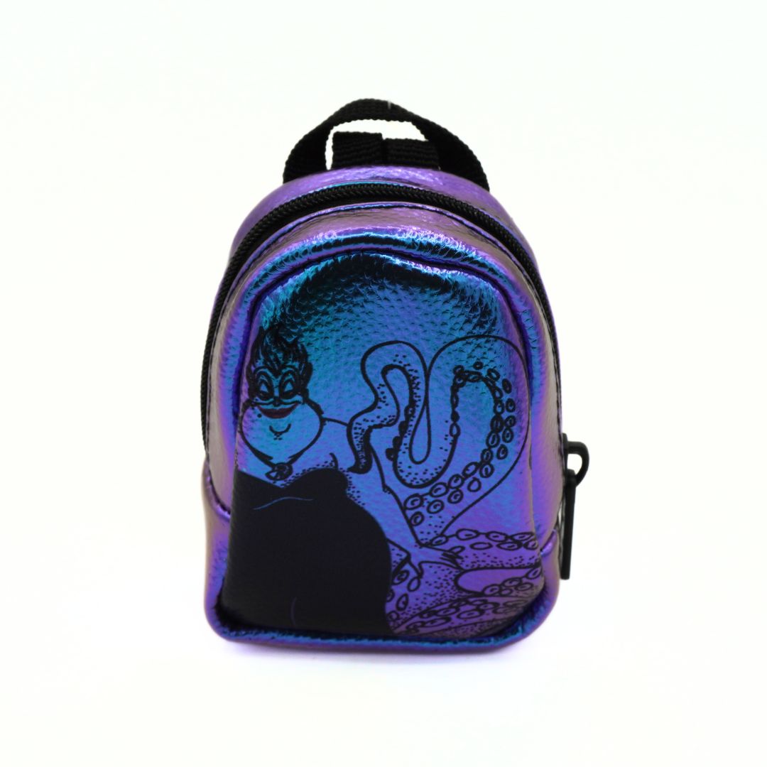A small iridescent mini backpack featuring a black silhouette of Ursula from The Little Mermaid on the front, set against a plain white background.