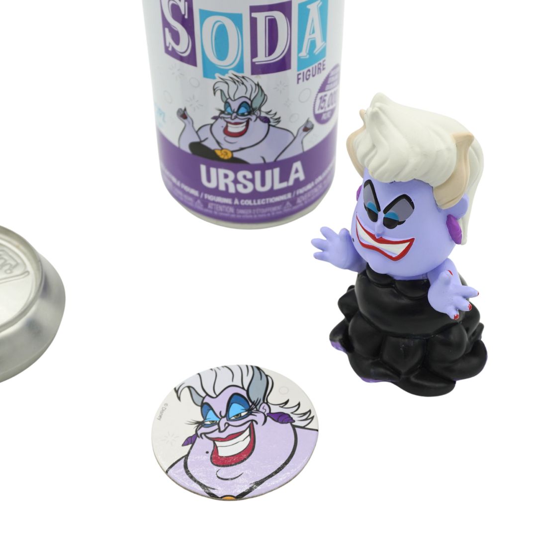 Disney Ursula collectible figure shown with its canister packaging and a round sticker on a white background.