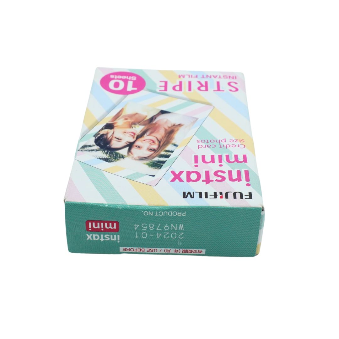 A box of Fujifilm Instax Mini film photos, featuring a pastel striped design with pink text and a photo of two people on the front.