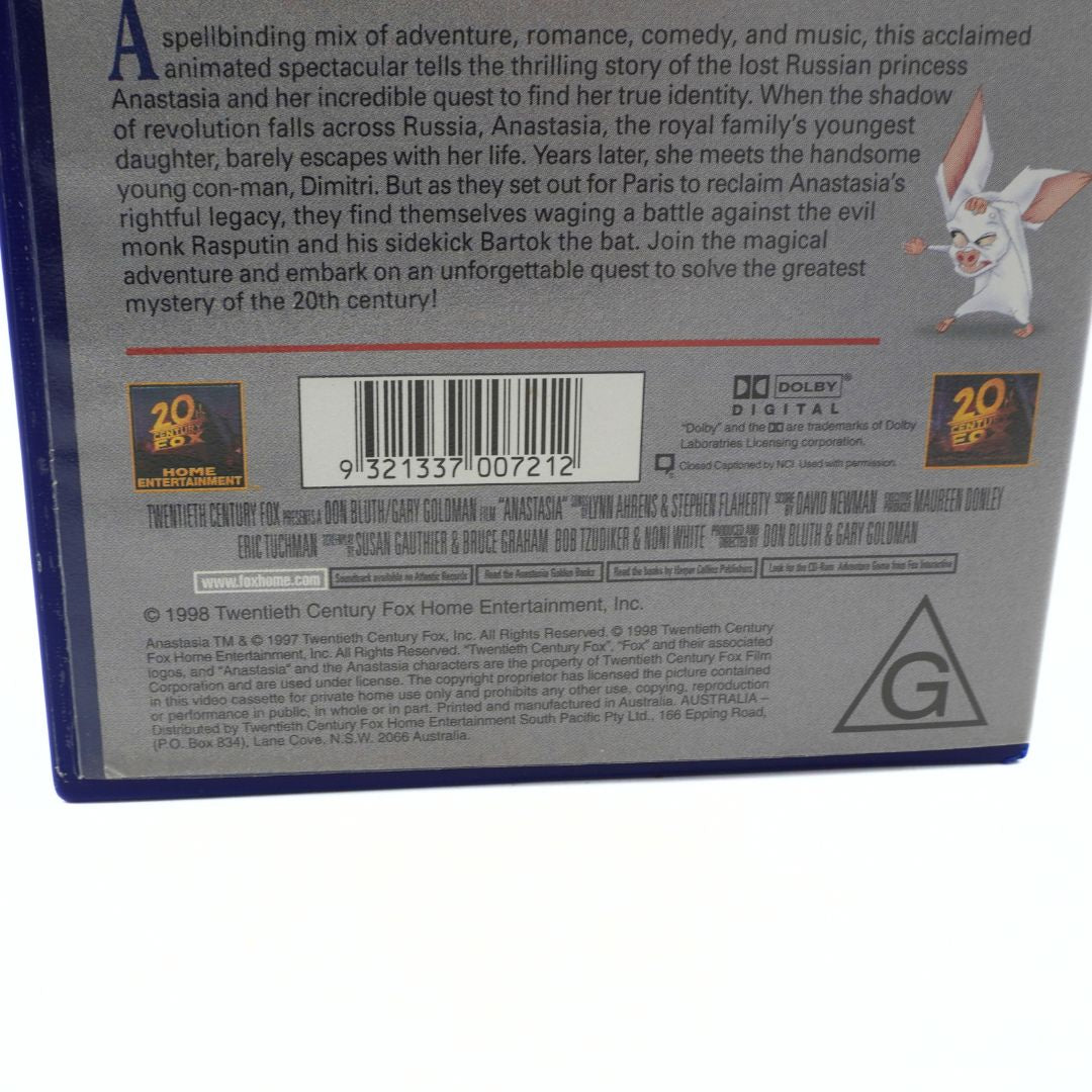 Back cover of a VHS case with text and a barcode, featuring an animated character.