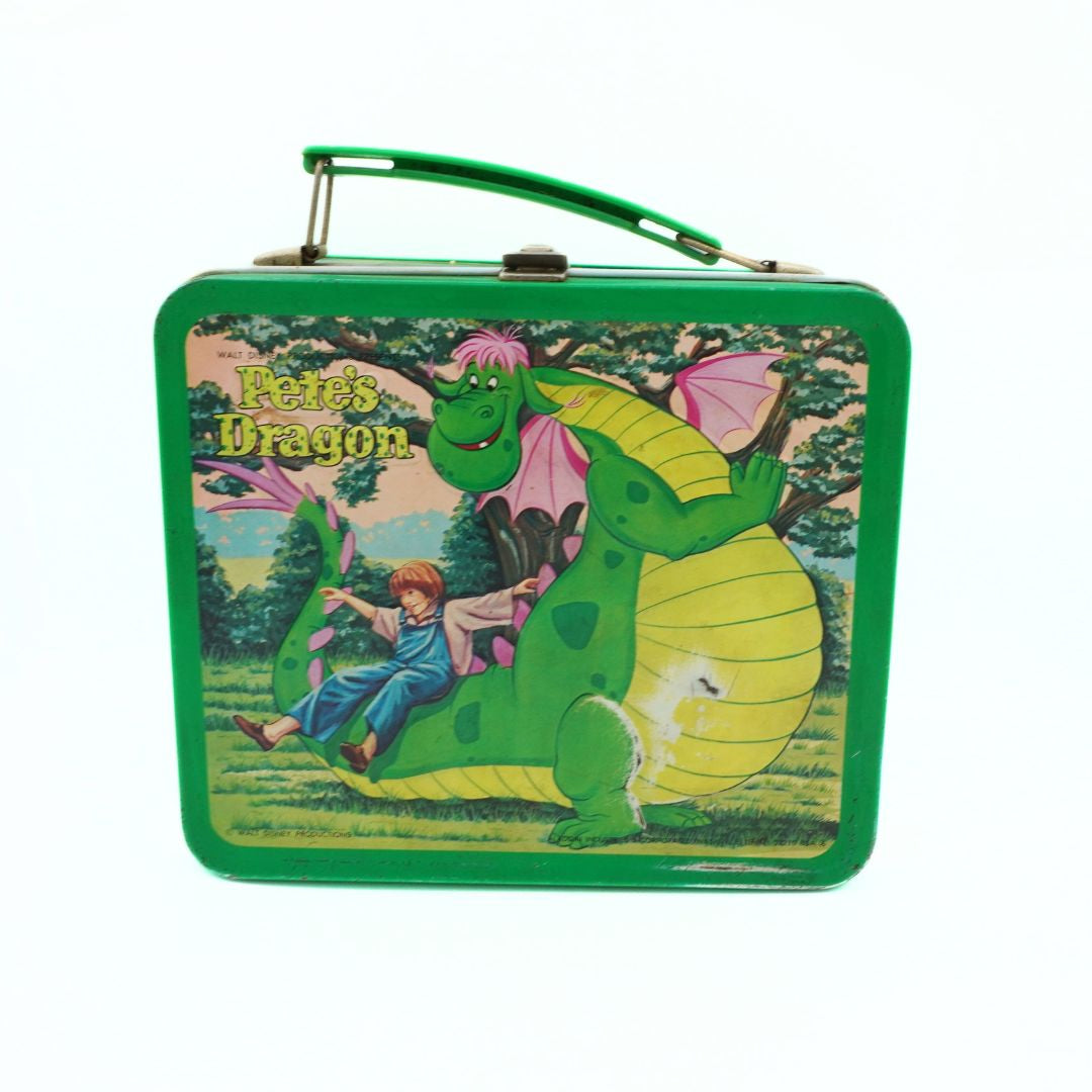 Green metal lunch box with 'Pete's Dragon' illustration featuring a boy and dragon.