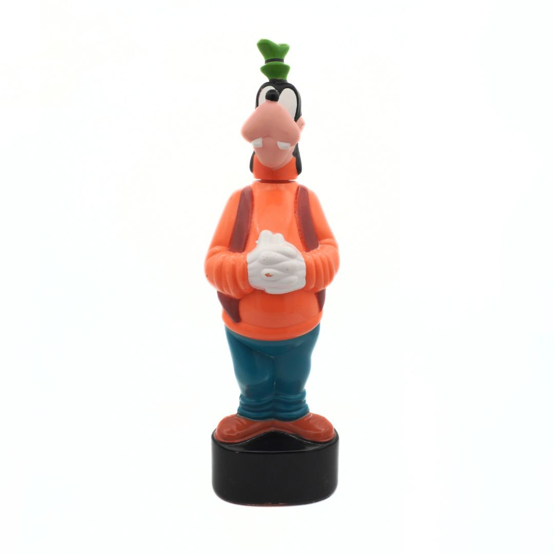 Cartoon character figurine with orange shirt and green hat on a white background