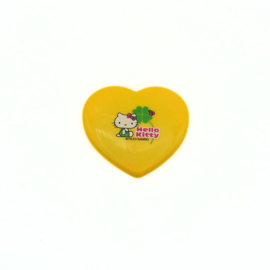 Yellow heart-shaped mirror with Hello Kitty logo on a white background