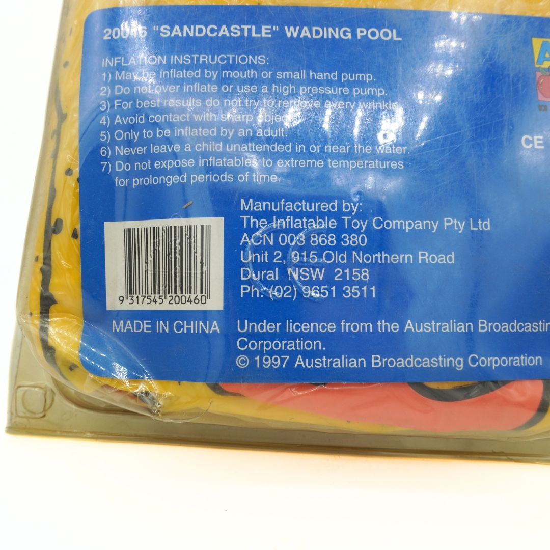 Back of an inflatable sandcastle wading pool packaging with text and a barcode.