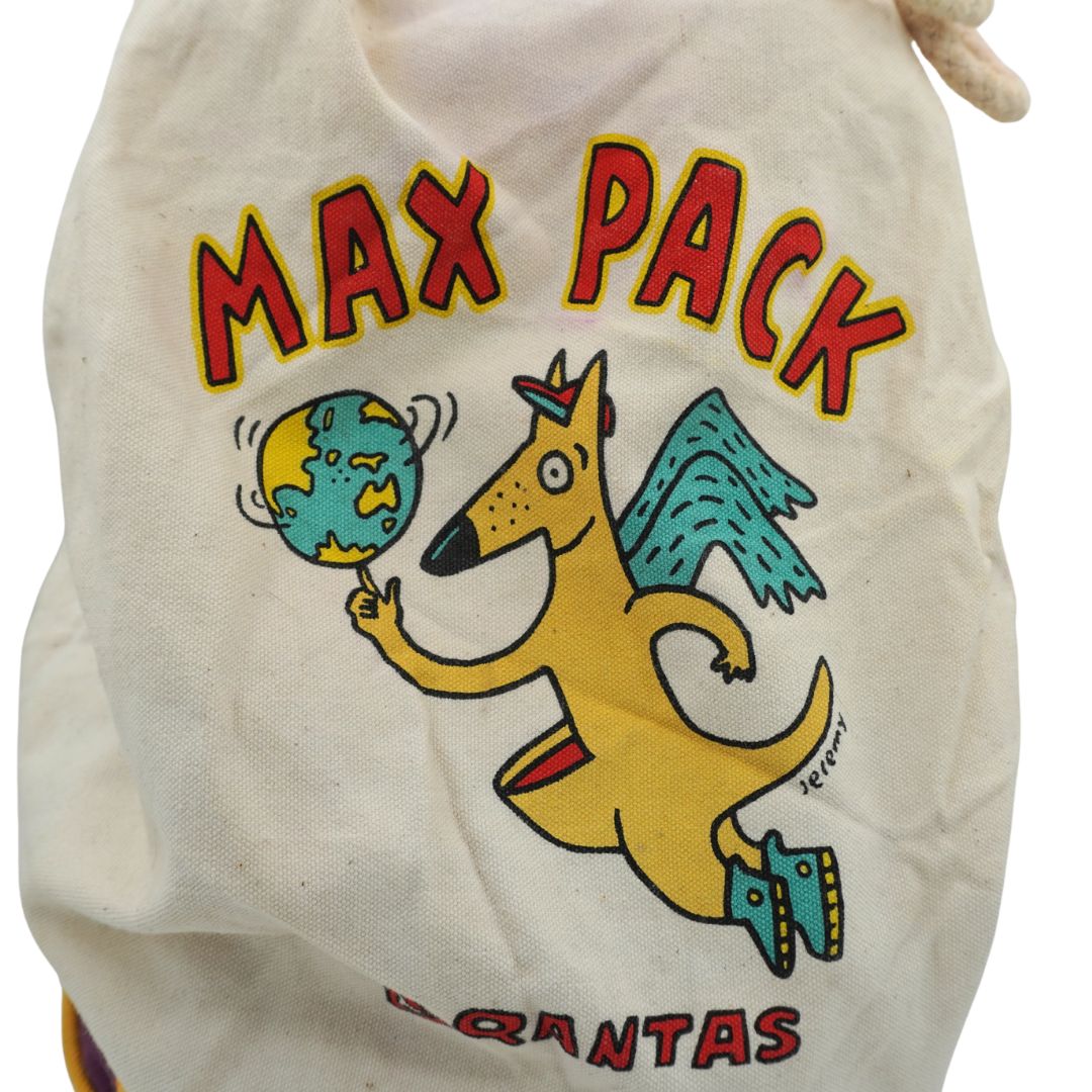 An off-white canvas drawstring bag featuring a colorful cartoon graphic of a yellow kangaroo holding a globe, with the text 'MAX PACK' in red and 'KANGARUS' at the bottom.