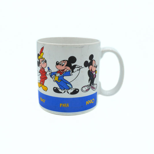 Mug with cartoon characters and '1955' text on a white background