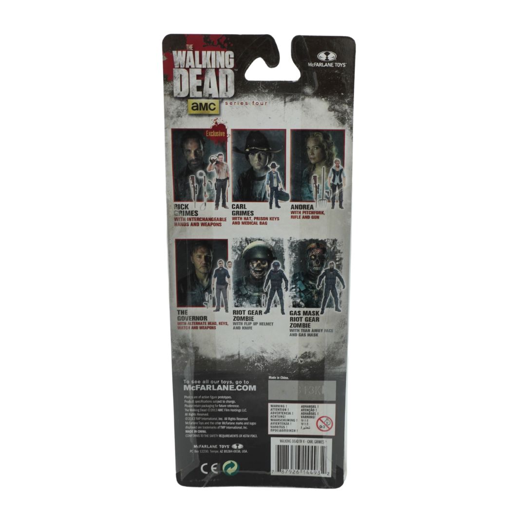 Packaged toy figure of characters from 'The Walking Dead' with branding and product details.