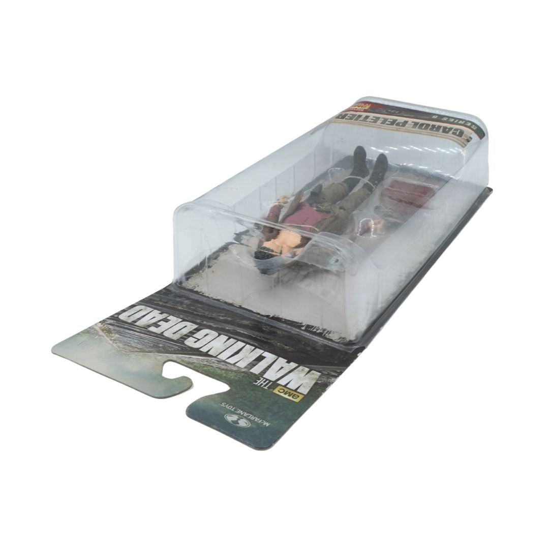 Model toy in packaging with 'Walking Dead' branding on a white background