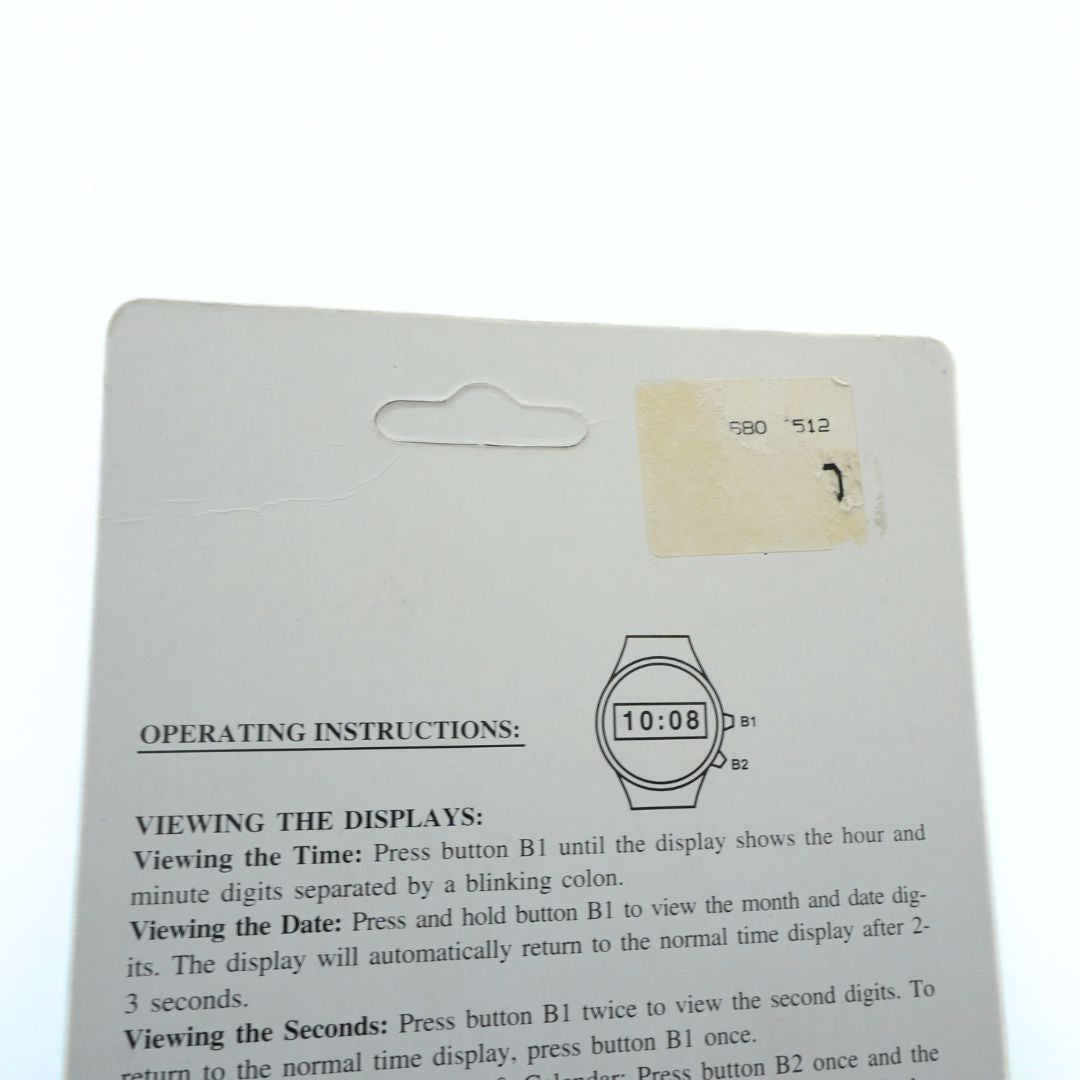 Wristwatch packaging with operating instructions on a white background